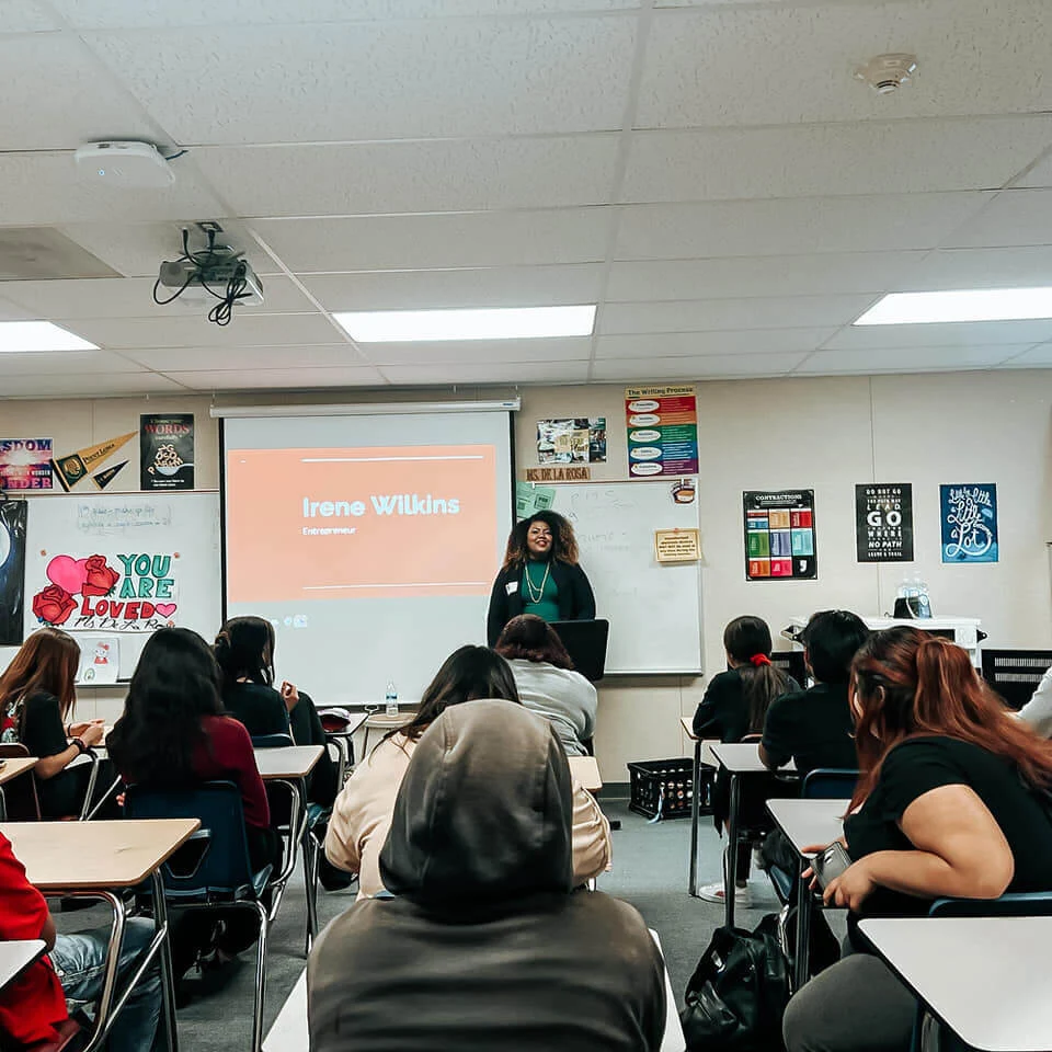 Irene Wilkins presenting to a seated classroom group
