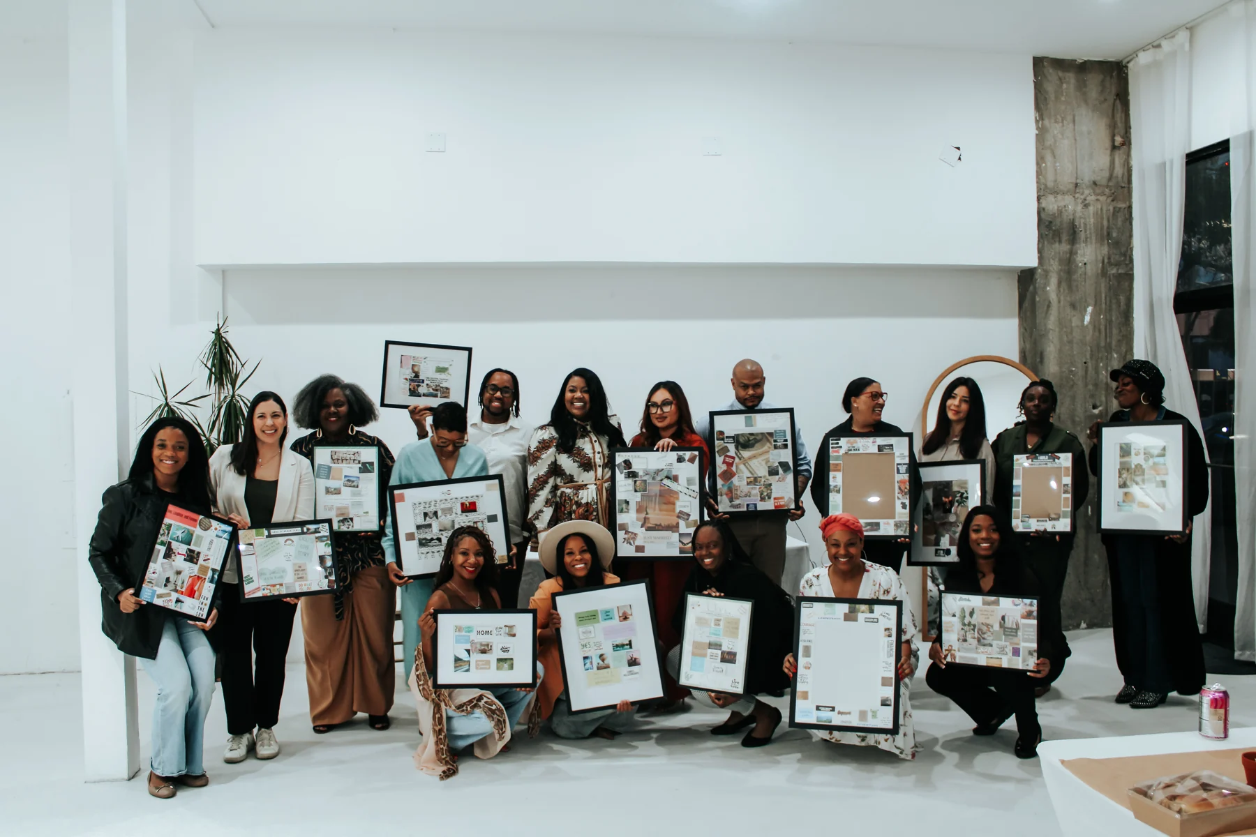 Workshop participants with Irene Wilkins displaying their completed vision boards